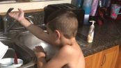 Even the most ordinary routines can leave room for a well-timed surprise.<br/><br/>In the clip, a young boy stands at a sink and reaches toward the faucet.<br/><br/>\